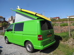 SX14110 Popup up with big yellow surfboard on roofrack.jpg